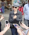 23728_Celebutopia-Kylie_Minogue_signing_some_autographs_for_fans_after_doing_some_shopping_in_Zurich-01_122_84lo.jpg